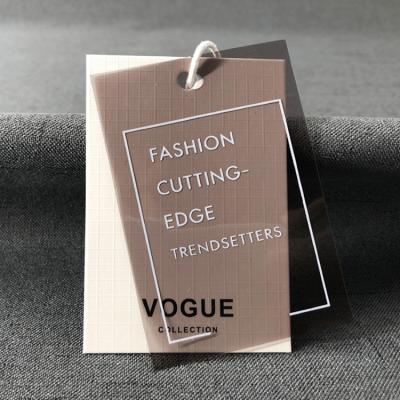 China Vogue Brand Clothing Accessories Custom Made Clothing Label Plastic PVC And Paper Label Label Vogue Logo Label Viable for sale