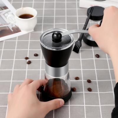 China Portable Outdoor Small Size Clear Plastic Pendulum Shape Hourglass Manual Coffee Bean Grinder for sale