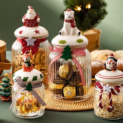 China Christmas Cute and Novelty Sealed Glass Jar Decorative Candy Food Grade Cookies Sealed Kitchen Storage Food Bottle With Lid for sale