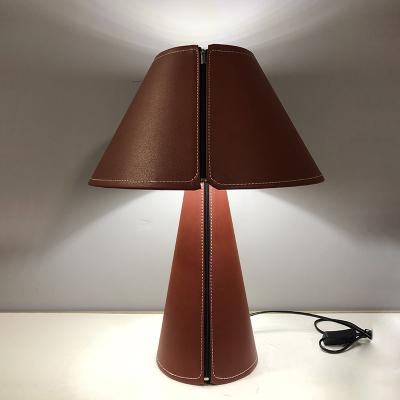 China New hotel table lamp home living room bedroom study decorative table lamp modern personality leather material modern for sale