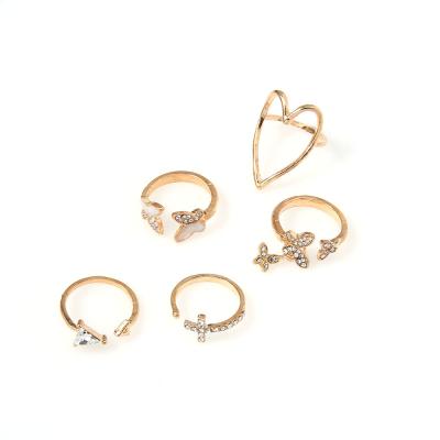 China TRENDY Cross Triangle Heart Hollowed-out Oil Butterfly Ring 5 Sets Knuckle Ring for sale