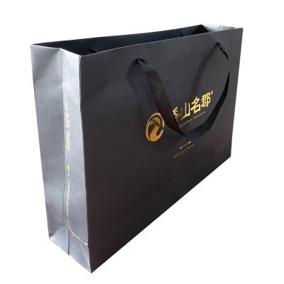 China Nice materials recycled luxury paper shopping bags with handle custom printing with your own logo for sale