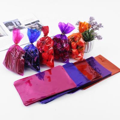 China Disposable Manufacturer Made Birthday Decoration Plastic Wrapping Paper Color Cellophane Halloween Gift Decorative Candy Bag for sale