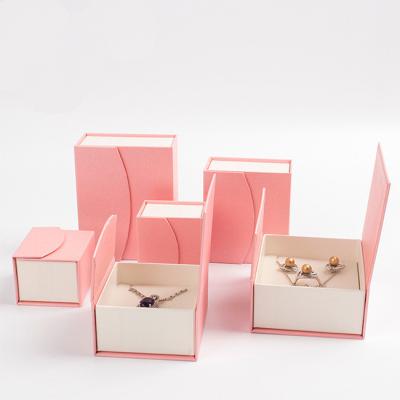 China Joyero Mini Wholesale Custom Blue Beige Materials Reused Jewelry Packaging Box Jewelry Boxes With Pouch for sale