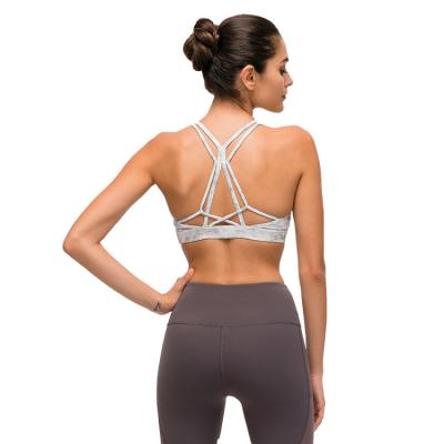 China 2021 New Arrival Custom Yoga Top Complex Breathable Hollow Out Back Shockproof Yoga Sport Bra for sale