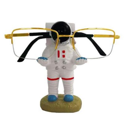 China Table Free Standing Astronauts Glasses Stand Resin Dog Glasses Sunglasses Stand Holder Rack for sale