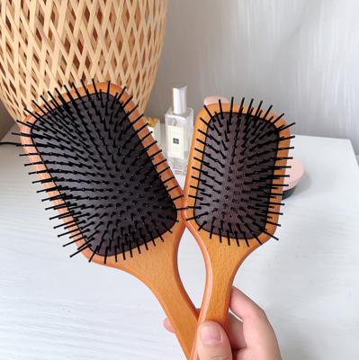 China Best Selling Big Comfortable Wooden Color Board Comb Airbag Round Head Massage Anti-static Hair Brush for sale