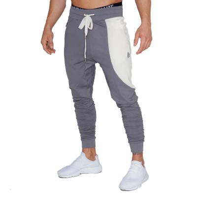 China QUICK DRY Men's Sports Fitness Training Breathable Casual Pants Color Rope Feet Pants Men Casual Pants Slim Fit for sale