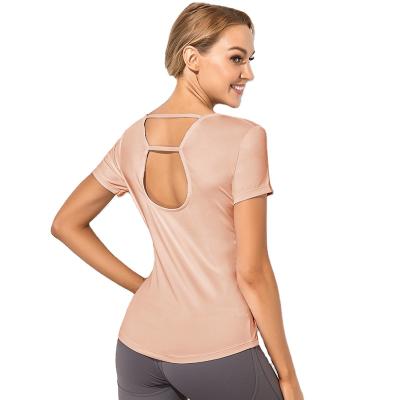 China Breathable Female Sports Loose T-shirt With Bare Back Breathable Yoga Suit Sports Fitness Running Hollow Jacket With Short Sleeves for sale