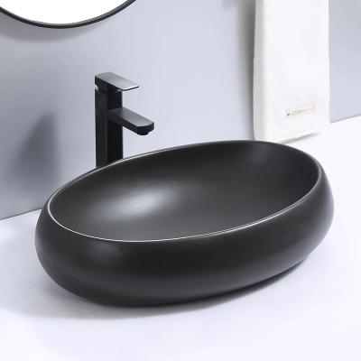 China Hot Selling Easy Clean Oval Bathroom Basin Ceramic Tables Sink Art Basin for sale