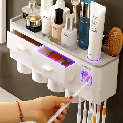 China Single Toothpaste Dispenser Rack Single Toothbrush Holder Bathroom Toothbrush Holder Wall Mounted Four Cups for sale