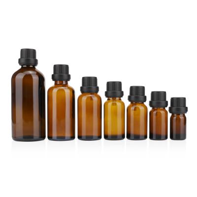 China Personal Care 30ml 50ml 100ml Round Glass Empty Essential Oil Amber Bottle With Screw Cap for sale