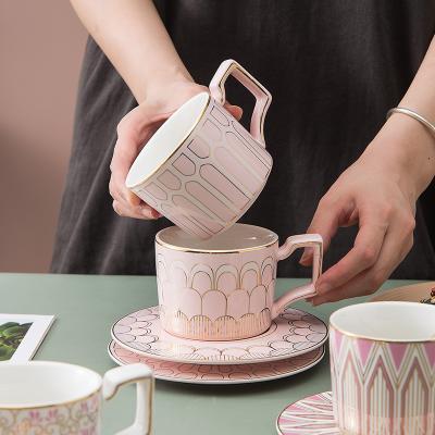 China Viable Creative Geometric Ceramic Rim Coffee Cup Nordic Feiyou Ceramic Cup Rose Gold With Saucer And Spoon for sale