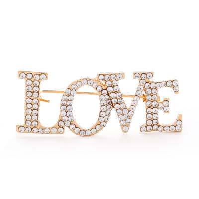 China Gold Towel Rhinestone Love Letter Simple Elegant Light Silk Buckle Imported Pin Romantic Pin Brooch for sale