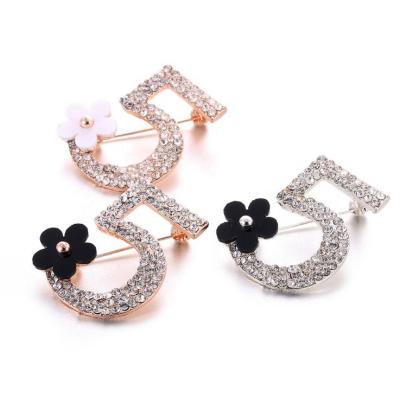 China New Personality Crystal Brooch Clothing Korean American Number 5 Flowers Brooch Fashion Small Creative Personality for sale