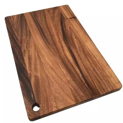 China Custom Viable Logo Multi Purpose Black Walnut Wooden Cutting Board With Hanging Hole Juice Groove Butcher Block Space Saving Kitchen Tool for sale