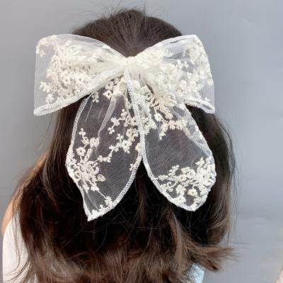 China Environmental friendly environmental friendly all kinds of black and white lace bow hair clip and pure manual heavy work, lock edge, small cool platypus clip for sale