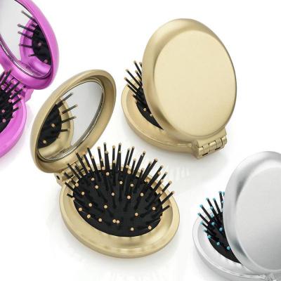 China Custom Logo Foldable Hair Brush Pocket Waterproof Detangle Mini Folding Hair Brush Foldable With Makeup Mirror for sale