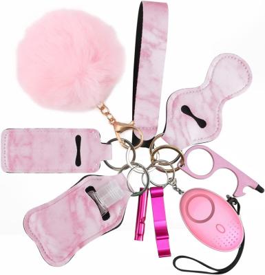 China Portable Metal Self Defense Key Chain Set for Women and Girls with Security Alarm Car Key Chains Accessories with Pom Keyring Wristband for sale