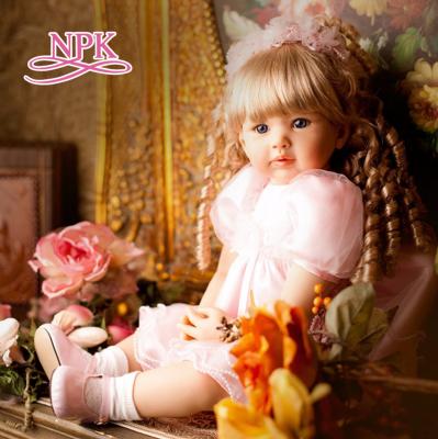 China Realistic Toddler Baby Girl SNAPSHOT 60CM Blonde Hair High Quality Collectible Doll Curly Reborn Princess In Pink Skirt for sale