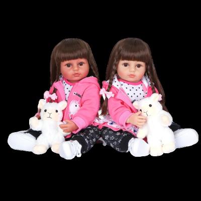 China WholesaleWholesale Newborn Flexible Babydoll Two Colors 55cm Long Hair Girls Gift Soft Silicone Vinyl Doll Soft Skin Pink Coat for sale