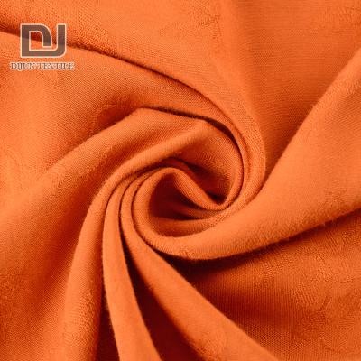 China Viable Competitive Price Orange Dobby Striping Viscous Flowers Jacquard Fabric For Dresses for sale