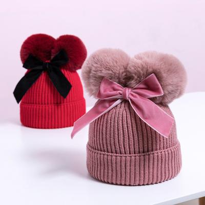 China COMMON Custom Baby Hats With Two Warm Pompom And Bow Kids Winter Knit Hat Beanie Hat for sale