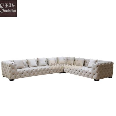 China Hot Selling Customized Tufted L Shape Sectional Chesterfield Modern Sectional Velvet Sofa Fabric Sets Sofa For Living Room for sale