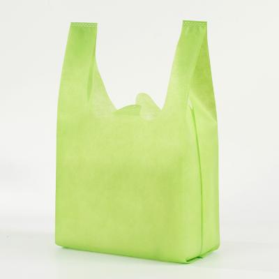 China Eco-friendly Grocery Non Woven Fabric Shopping Bags T-shirt Bag PP Cheap Nonwoven Shopping Bags for sale