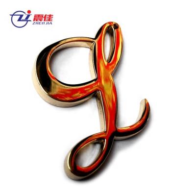 China Fasion Customized Simple Metal Letter Logo Label for sale