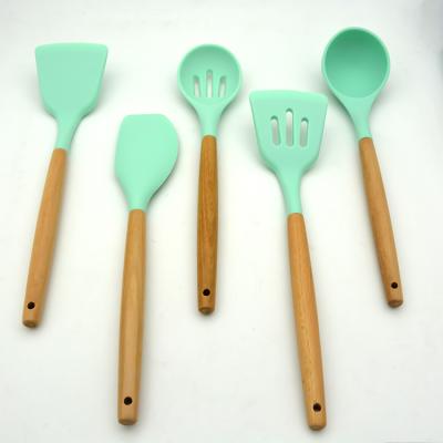 China Modern Kitchen Utensils Non-Stick Silicone Handle Set Spoon Rest Non-Stick Barreled Silicone Wooden Pouch for sale