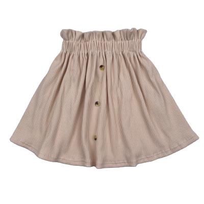 China New Solid Color Washable Stylish Baby Girl Clothing One Line Elastic Band Skirt Plus Size Dress Short Skirt Baby Skirt With Button for sale