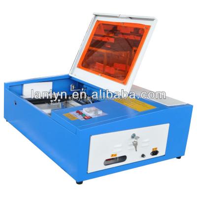 China Laser Engraving Rubber Stamp 40W Fast Laser Engraving Machine / Desktop Laser Cutting Machine 3030 for sale