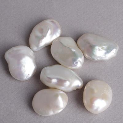 China New Freshwater Pearl Classic Luster Top Pretty Oval Shape Pure White 100% Natural Keshi Pearl Loose Half Drilled Pearls for sale