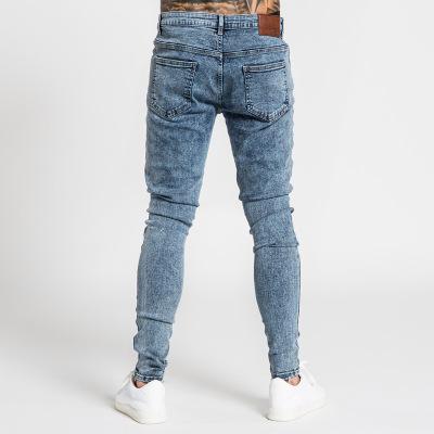 China 2021 new viable men's jeans fashion men's pants supply ripped small feet jeans men's pants designers trousers for sale