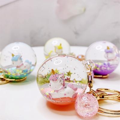 China 2021 Creative Acrylic Oil Liquid Quicksand Key Chain Crystal Ball Unicorn Floating Car Key Chain Pendant Bag Custom for sale