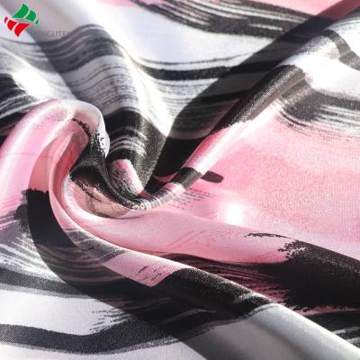 China Waterproof super soft feeling 100%polyester glazed twist satin fabric for dress garment for sale