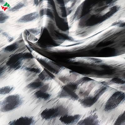 China Waterproof leopard prints 97%polyester 3%spandex glazed stretch satin fabric for dress garment for sale