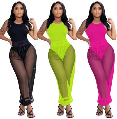 China QUICK DRY sleeveless solid jumpsuits tops loose styles see through wide leg pants sets sexy beach wear for sale