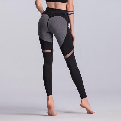 China Antibacterial Heart Leggings Sporting Tight Women Yoga Pants With Phone Pocket Gyming Yoga Leggings For Women Butt Yoga Pants Gaiters for sale