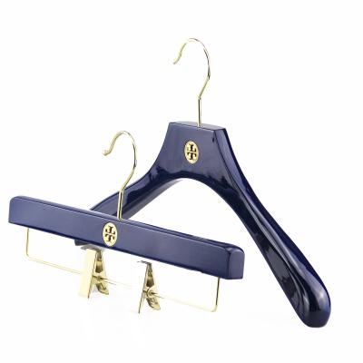 China Adjustable Blue Wooden Female Dress Hanger Wooden Women Clothes Hanger Customized for sale