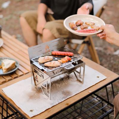 China Mini Adjustable Size Charcoal Grill Portable Folding BBQ Grill Space Saving and Collapsible BBQ Grill for Camping for sale