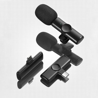 China Wireless Smartphone Lavalier Microphone 1V2 Lavalier Microphone UHF Collar Wireless Microphone Lavalier Lapel Microphones For DSLR Smartphone Video MIC for sale