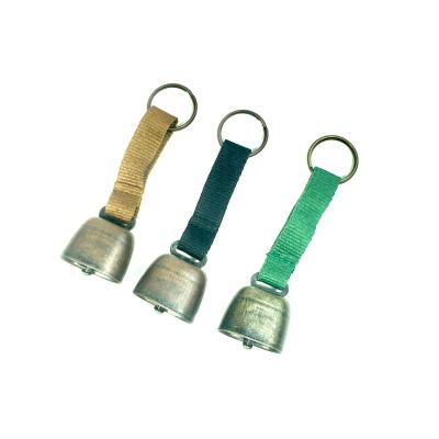 China Sustainable Outdoor Hiking Camping Warning Bear Bell with Color Ribbon Waist Cow Bell for sale