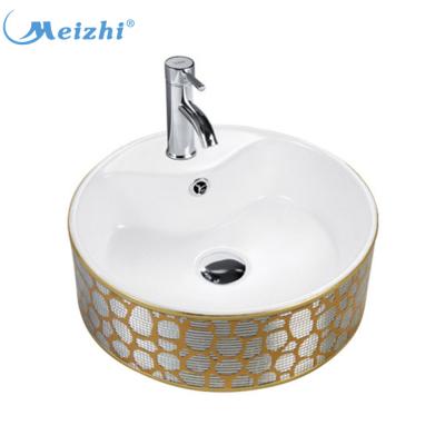 China Modern Luxury Gold Attractive Bathroom Decoration Ceramic Art Basin For Hotel for sale