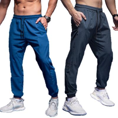 China Breathable Men Women Running Training Pants With Zipper Pockets Quick-Drying Sweat Soccer Trousers Jogging Fitness Workout Sport Pants for sale