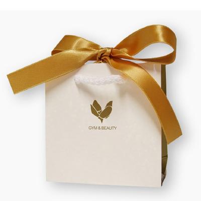 China Handmade Custom Fashion Your Own Design Logo Printing Bags Cosmetics Luxury Handle Gift Paper Bag With Ribbon Bow for sale