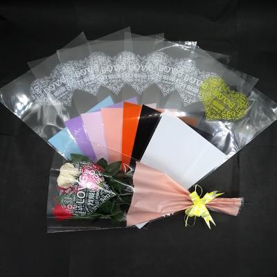 China Safety Heart Designer Single Rose Packaging Bags Flower Sleeve Reusable Paper Packaging For Flowers OEM ODM Floscular Cellophane Bag for sale