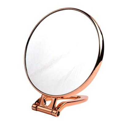 China Large Magnifying Metal Folding Magnifying Double Side Makeup Mirror With Handle for sale