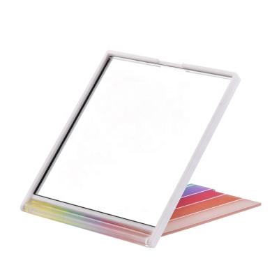 China Personalized Rainbow Makeup Pocket Plastic Single Side Folding Square Mirror Custom Made With Logo for sale